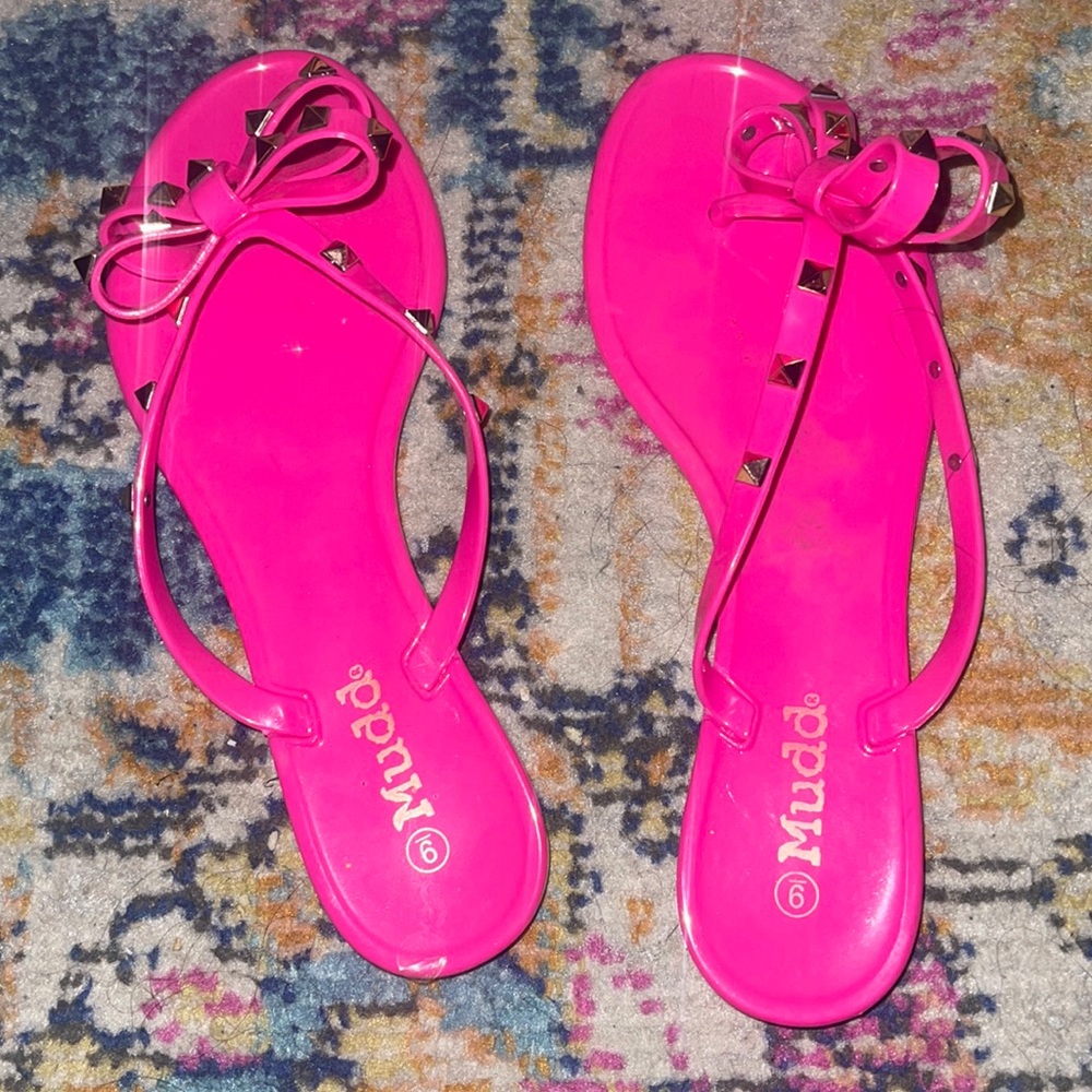 Hot pink rubber flip flops